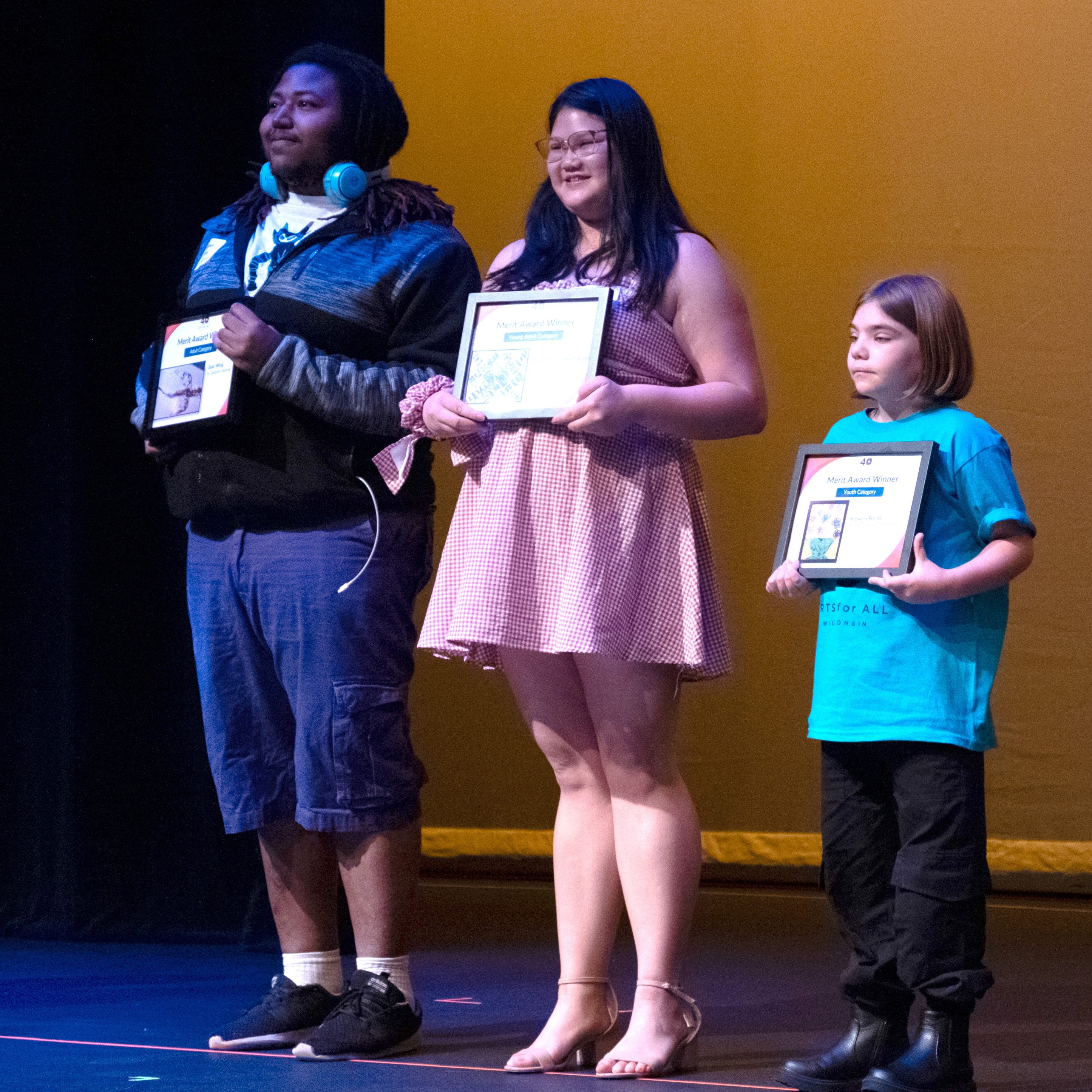 Three Merit Award winners pose for a photo. They are Stephon Ashley, Molly Solheim, and Paige Neuenschwander.