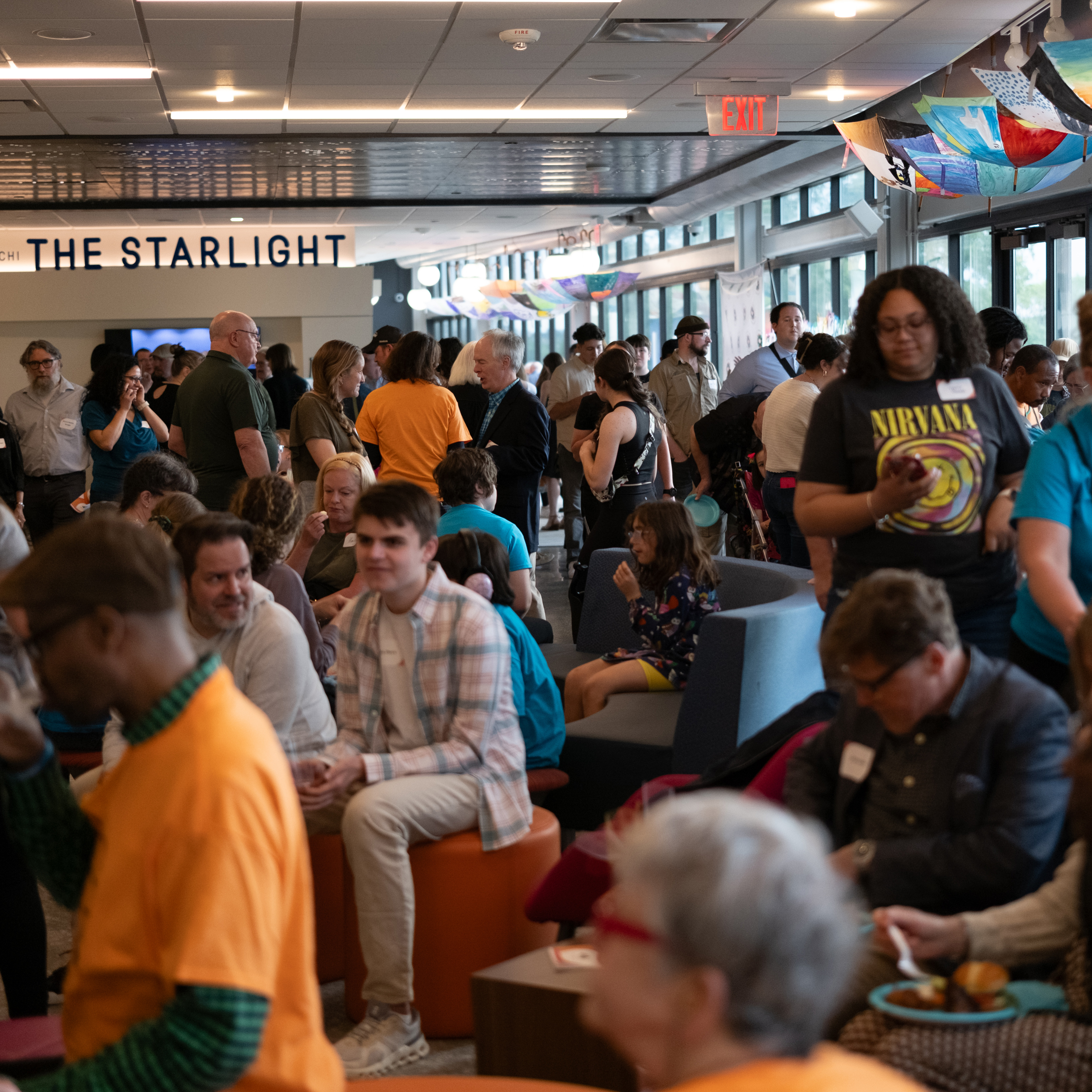 A crowd of people mingle while eating and drinking at the Creative Power Awards Celebration in 2025.